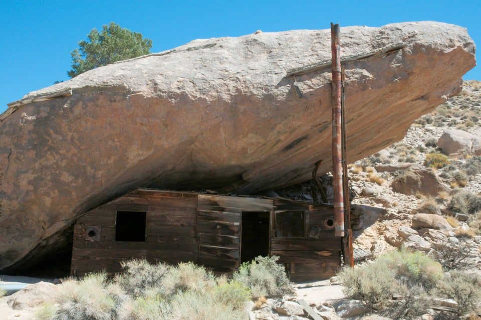 Cabin under a rock