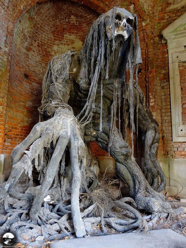 Demon Statue in old mausoleum
